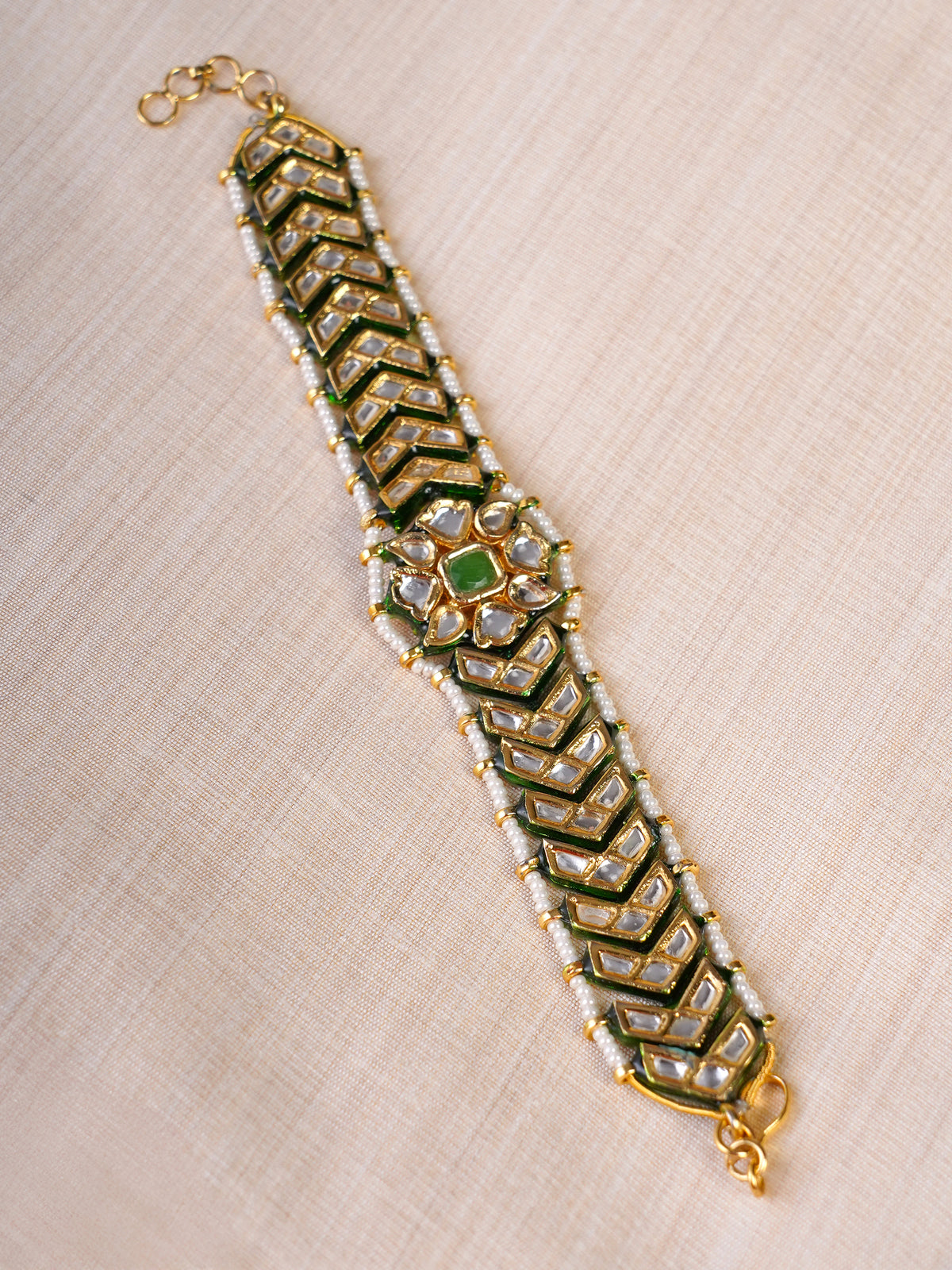 Samragni green meena kundan pearl bracelet styled on the wrist
