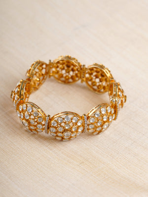 Sitaratna gold-plated round cluster moissanite bracelet styled on wrist