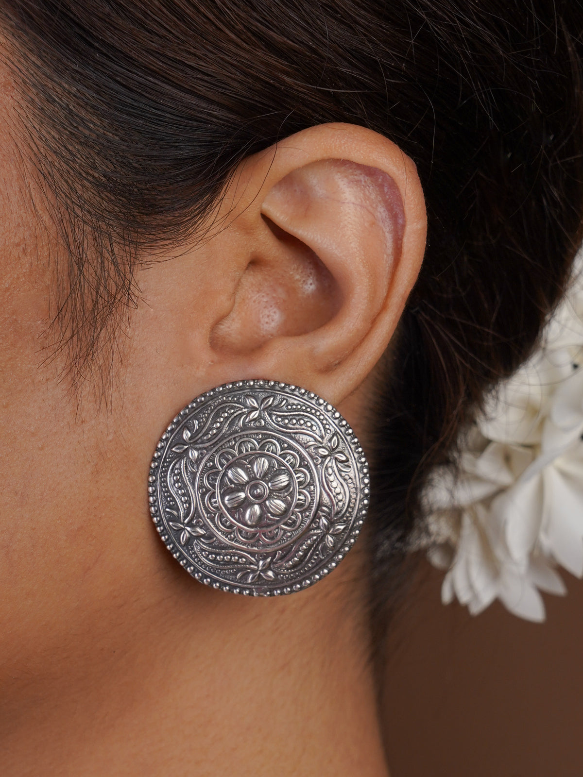 Sitavan oversized floral mandala oxidized stud earring styled on model with antique silver finish