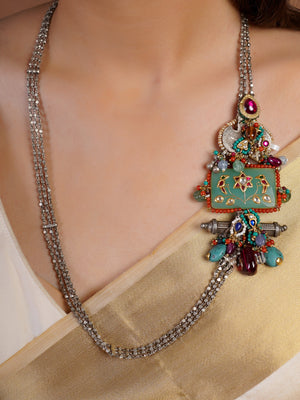 Sitamahor Navrangi enamel panel fusion long necklace styled with ivory saree and multicolour mixed-metal detailing
