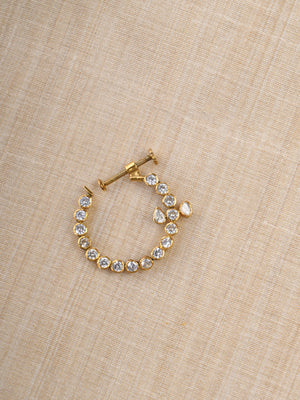 Sitaratna gold-plated round moissanite nath worn on model