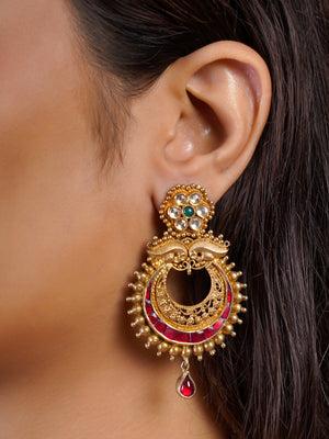 Samragni antique gold statement earring close-up with green floral stud, ruby crescent details and single ruby drop