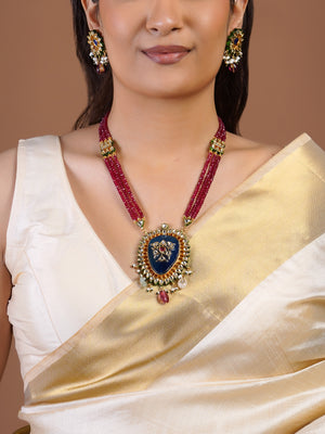 Samragni ruby bead blue kundan statement pendant necklace set with white stone halo, pearl drops and matching earrings