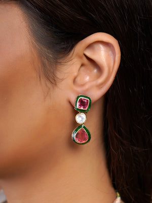 Samraagni ruby red and white kundan statement necklace shown on model with green enamel-style borders