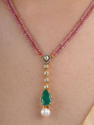 SITA RATNA matching green teardrop moissanite and pearl drop earring close-up