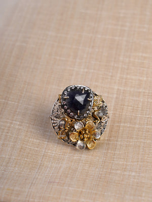 Sitamahor midnight black gemstone dual-tone floral fusion statement ring shown on hand with ornate silver and gold detailing