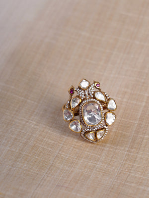Sitaratna white moissanite artisan cluster statement ring shown on hand with large clear centre stone and mixed-cut white accents