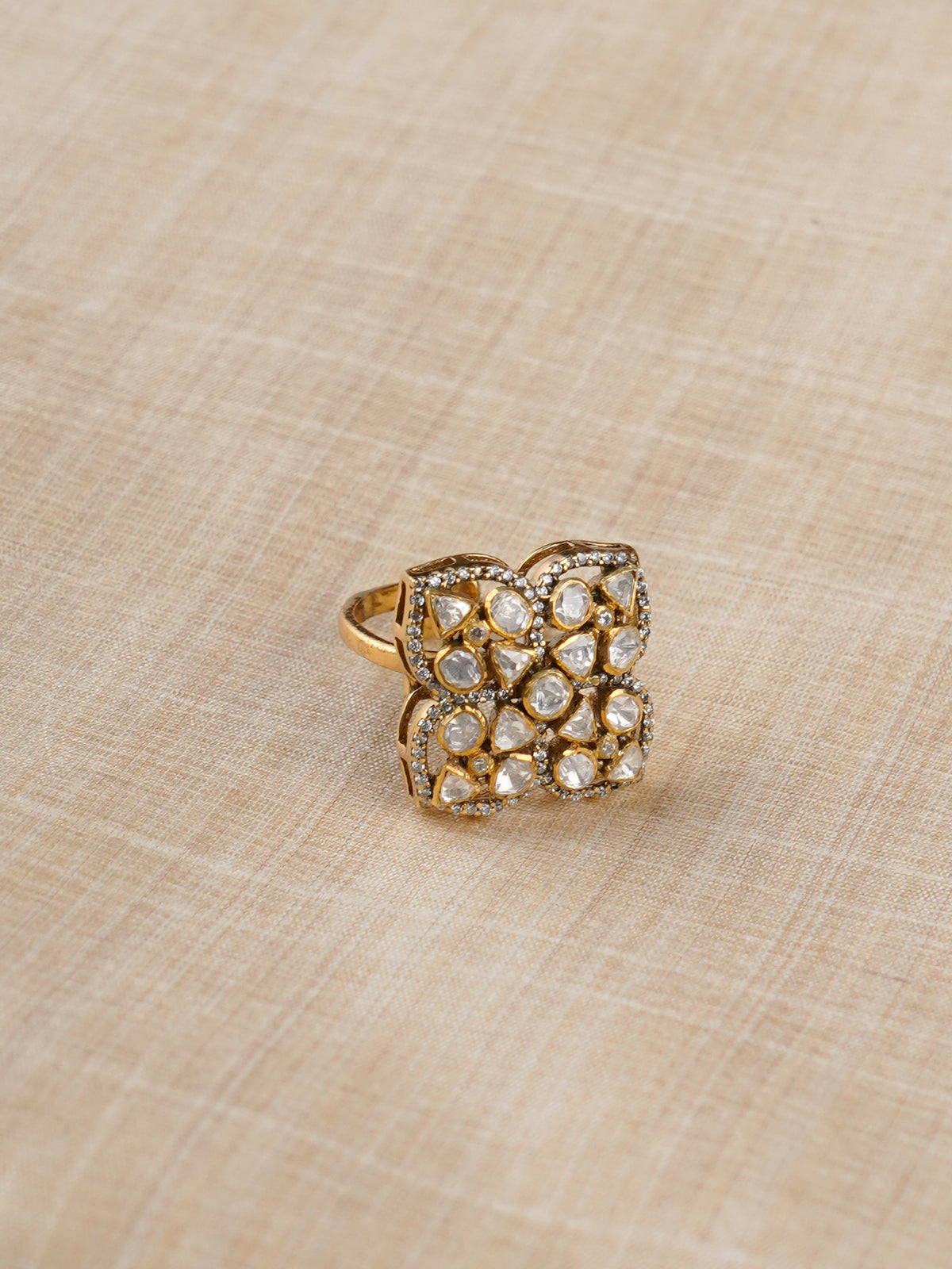 Sitaratna white moissanite quatrefoil gold-plated ring styled on hand