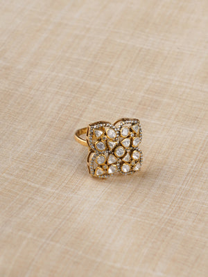 Sitaratna white moissanite quatrefoil gold-plated ring styled on hand