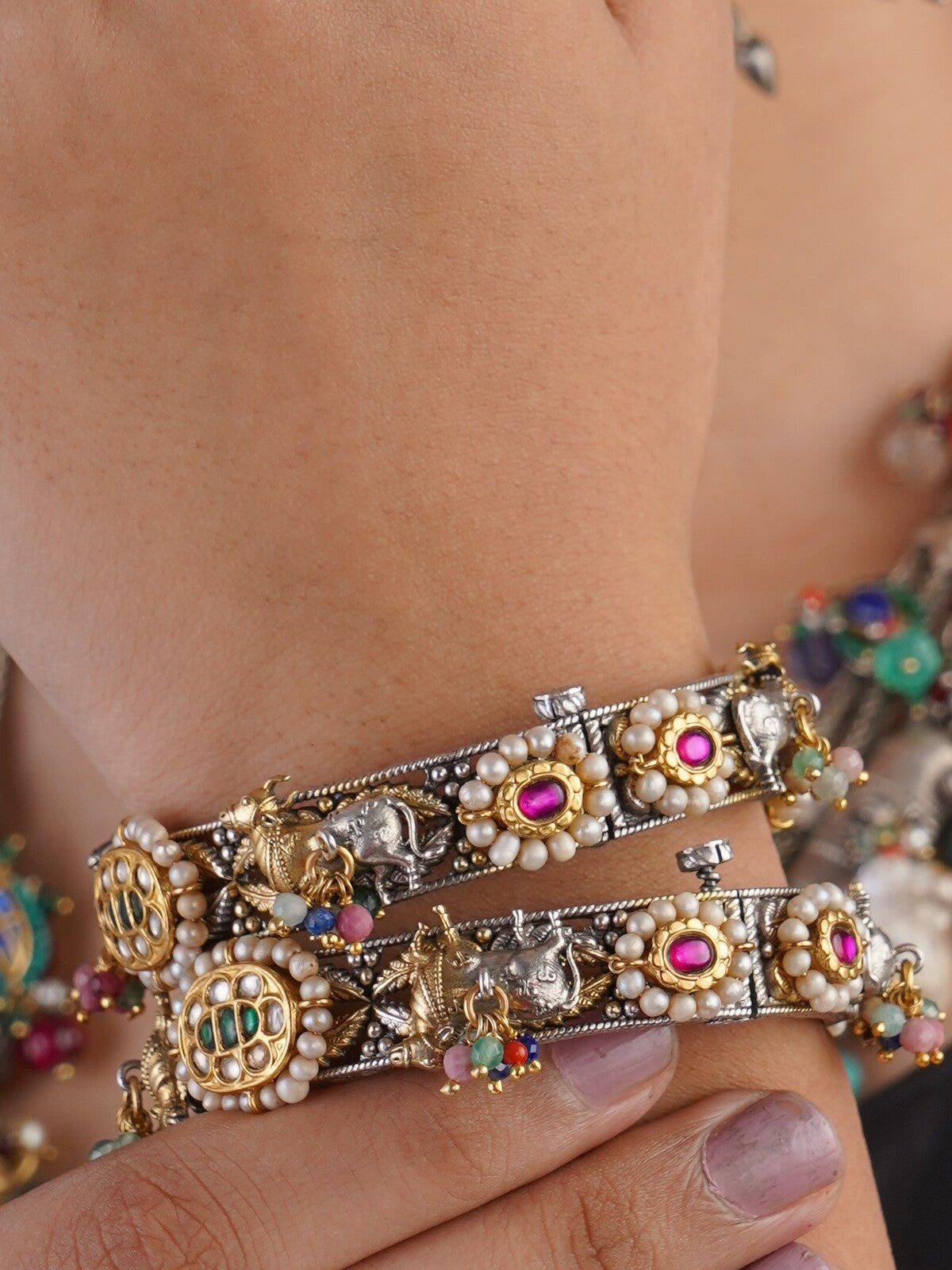 Samragni Gaja jadau pearl heritage bangle pair with elephant motifs, pink stones and multicolour bead accents by Sita Jewellery