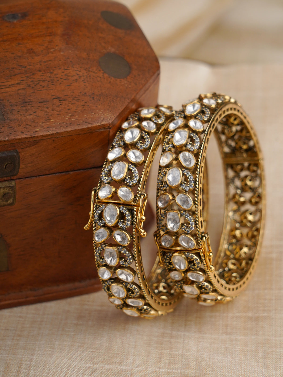 Sitaratna white moissanite gold-plated bangle pair styled on wrist