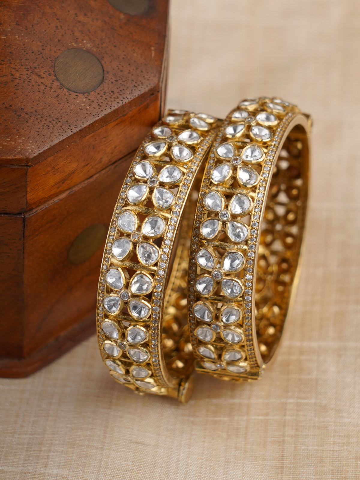 Sitaratna white moissanite floral gold-plated bangle pair styled on wrist