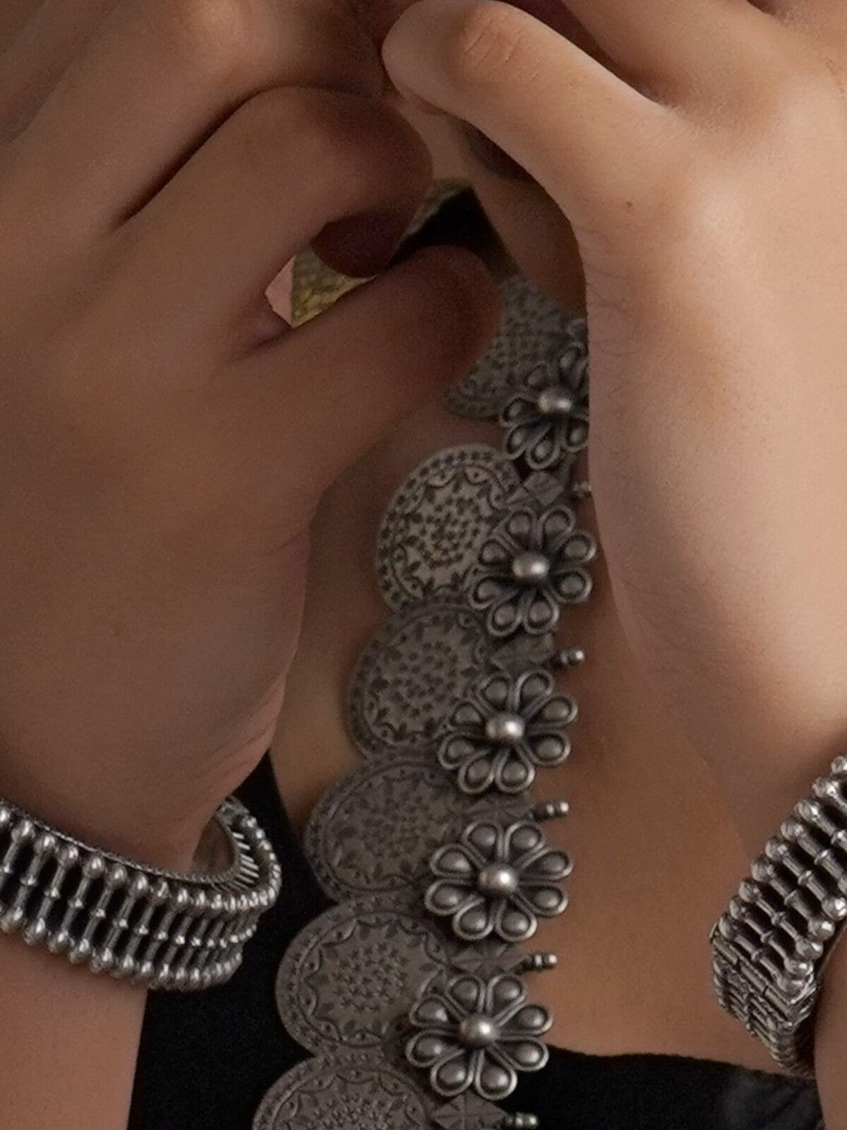 Sitavan Antique lattice oxidised silver bangles worn on both wrists with statement silver jewellery by Sita Jewellery