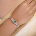 Sitamani Emerald floral AD silver bracelet with green centre flower and sparkling open-work band by Sita Jewellery
