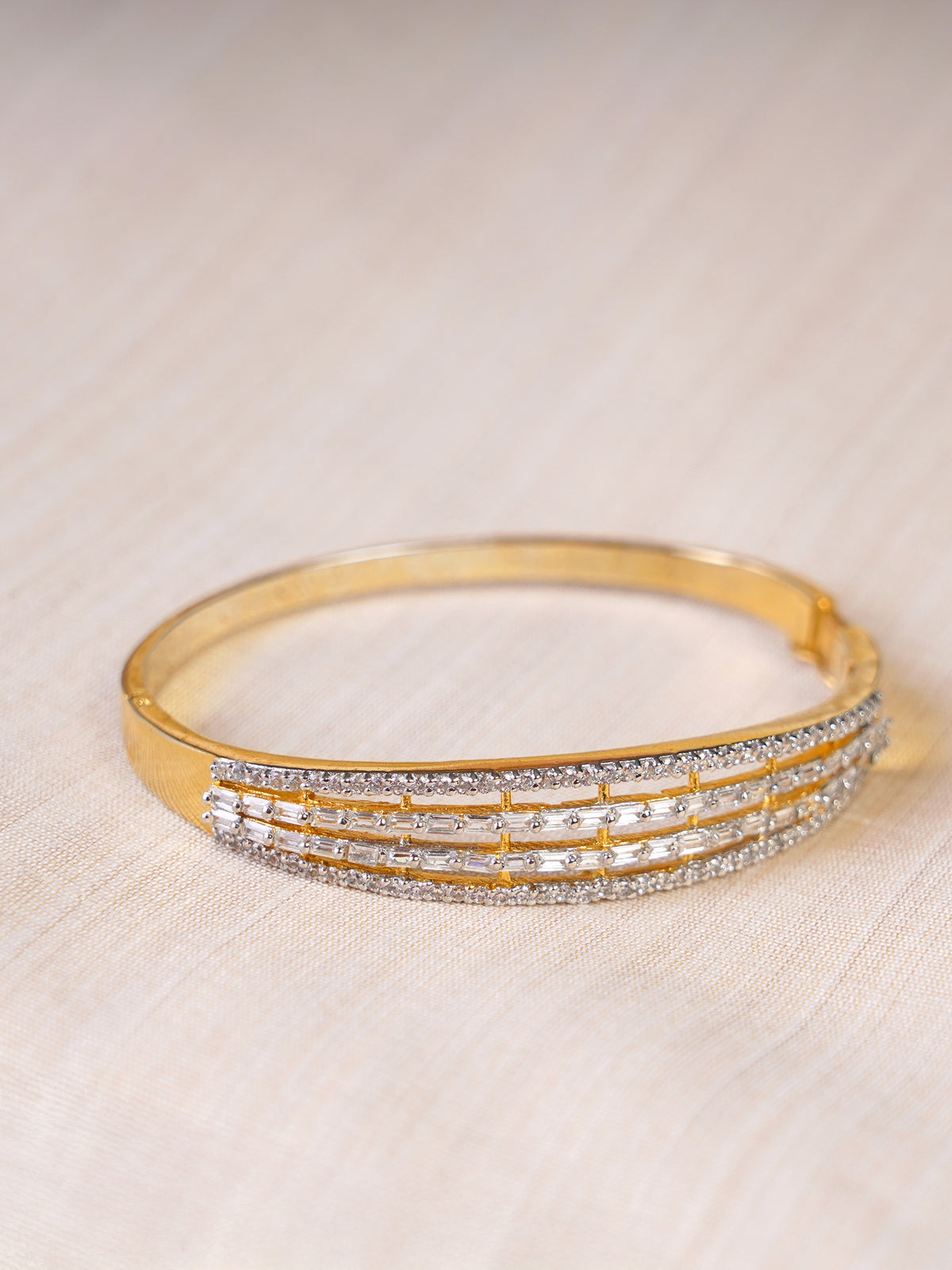 SITAMANI gold-tone triple-line baguette AD/CZ bangle styled on wrist by SITA JEWELRY
