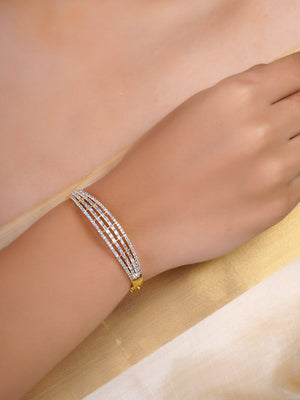 SITAMANI triple-line baguette AD/CZ bangle in gold tone with clear stones by SITA JEWELRY