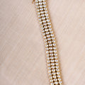 SAMRAGNI polki-inspired triple-row AD bracelet in gold tone with clear statement stones by SITA JEWELRY