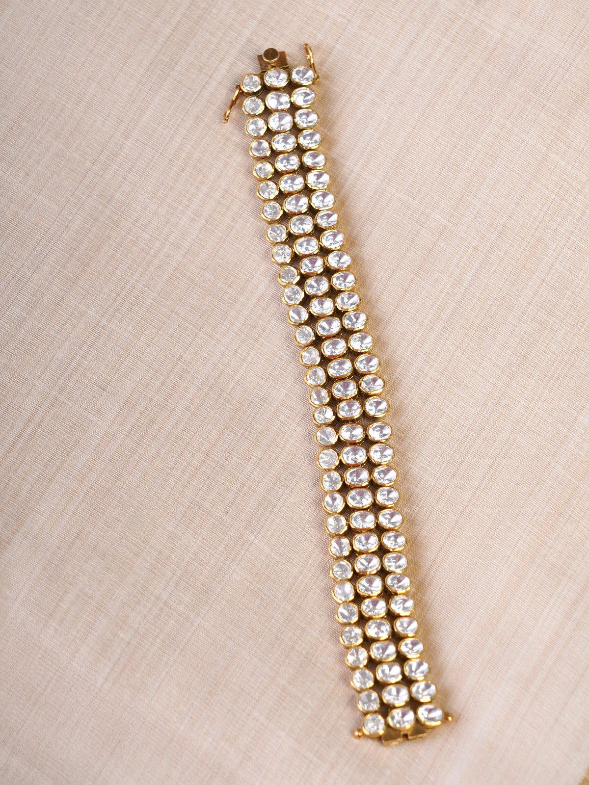 SAMRAGNI polki-inspired triple-row AD bracelet in gold tone with clear statement stones by SITA JEWELRY