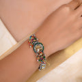 Sitamohur multicolour fusion bracelet shown flat with animal-inspired medallion, pearl accents and vibrant bead clusters