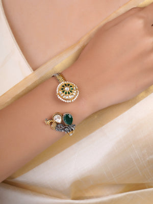 Sitamahor peacock green stone dual-tone fusion cuff shown on a cream textile background