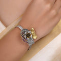 Sitamahor ruby floral paisley fusion bracelet styled on the wrist with sculpted mixed-metal detailing