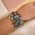 Sitamahor green bead charm collage fusion bracelet shown flat with layered heritage-inspired charms