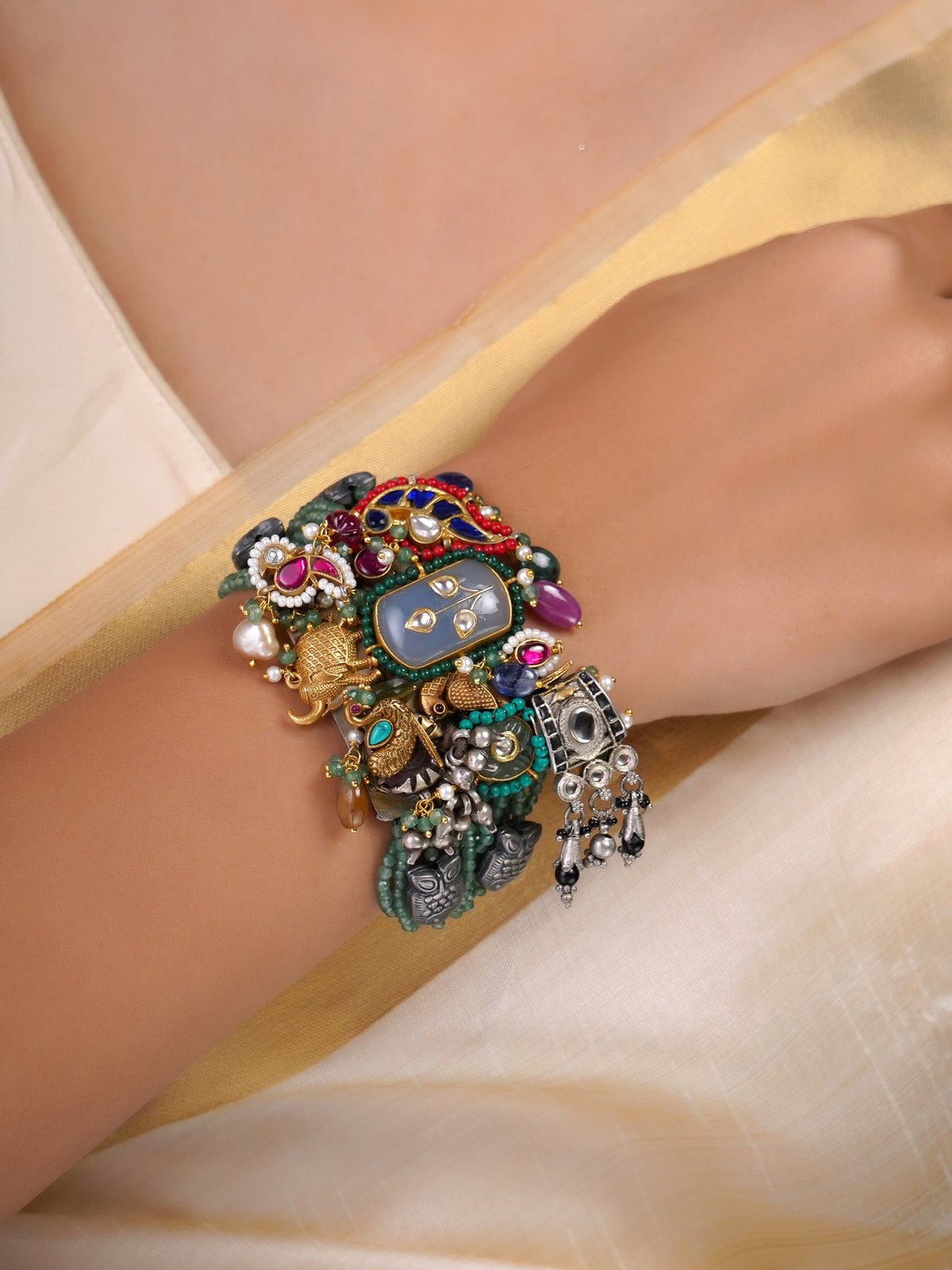 Sitamahor green bead charm collage fusion bracelet shown flat with layered heritage-inspired charms