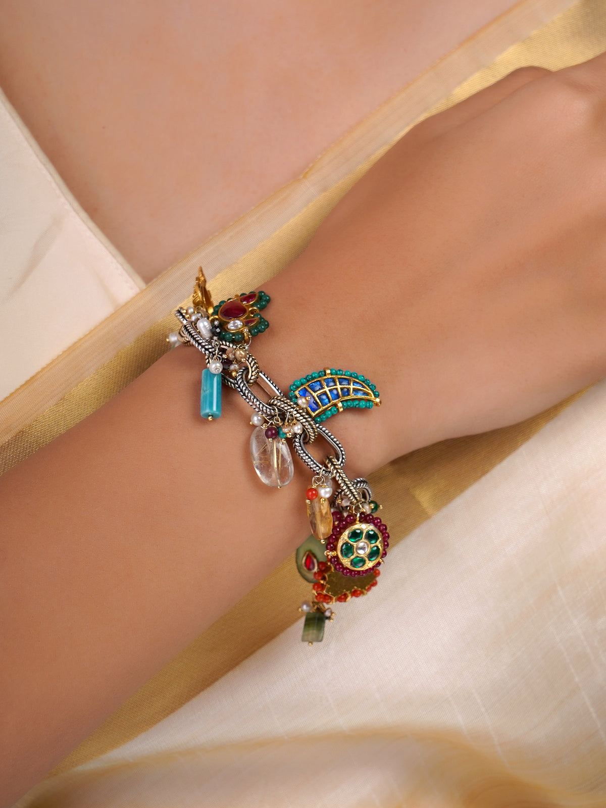Sitamahor Navrangi heritage charm fusion bracelet shown flat with multicolour charms, pearls and mixed-metal details