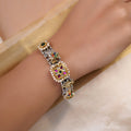 Samragni Rajwada square kundan pearl jadau bracelet styled on the wrist with pink, green and dual-tone detailing
