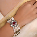 Sitaratna ruby pink pearl and moissanite statement bracelet shown flat with layered pearl strands and ornate central setting
