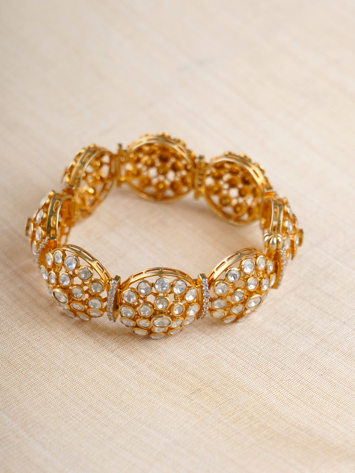 Sitaratna gold-plated round cluster moissanite bracelet styled on wrist