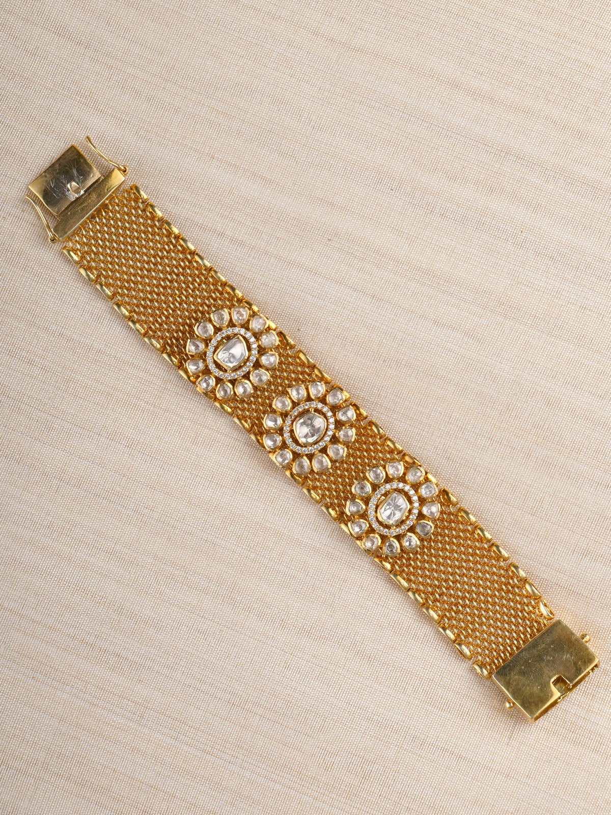 Sitaratna gold-plated triple floral moissanite mesh bracelet styled on wrist