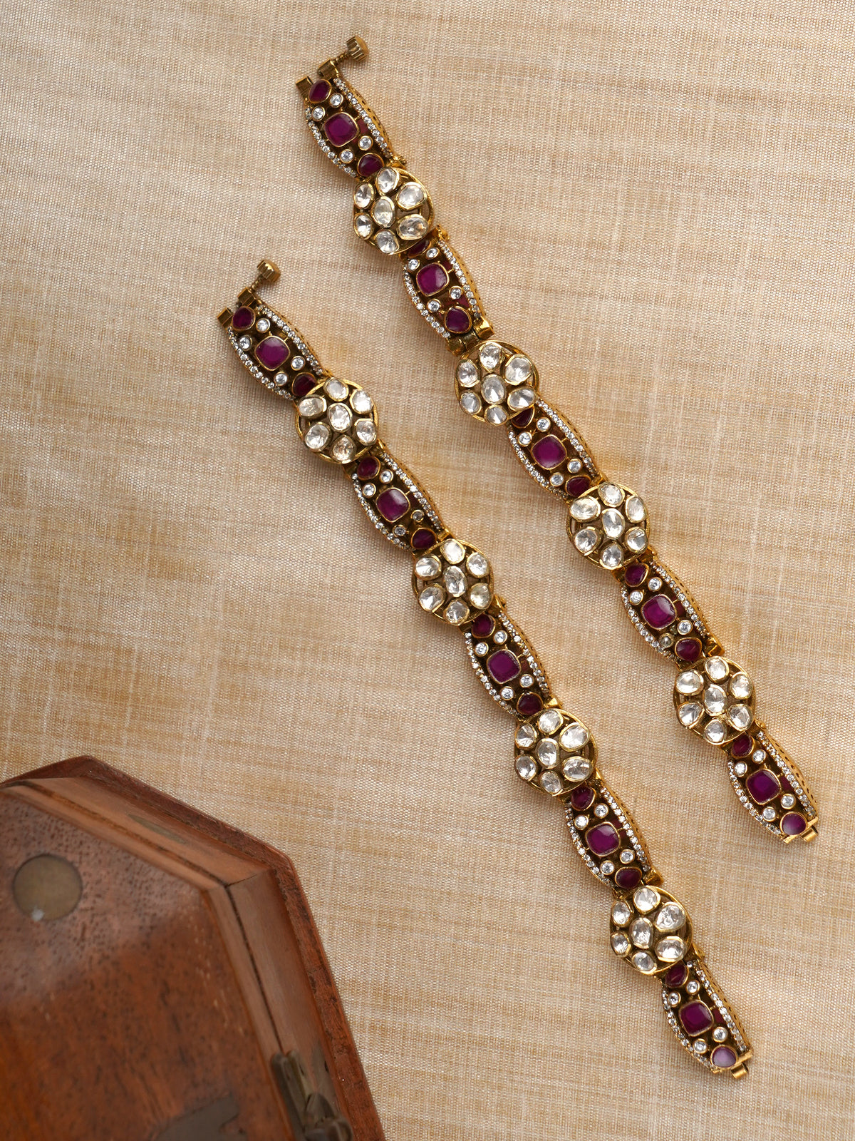 Sitaratna ruby and white moissanite gold-plated bracelet pair styled on wrist