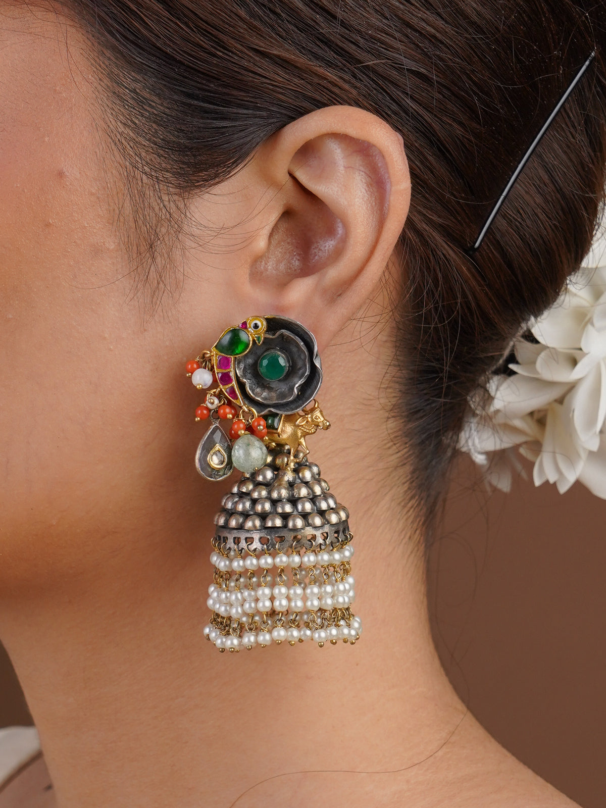 Sitamohur green stone pearl jhumka fusion statement earring styled on the ear
