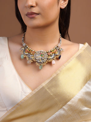 Close view of Sitamahor peacock pearl fusion necklace with silver gold motifs ruby green accents and pearl clusters
