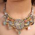 Sitamahor peacock pearl mixed metal fusion necklace styled with ivory saree and multicolour stone drops