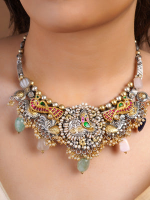 Sitamahor peacock pearl mixed metal fusion necklace styled with ivory saree and multicolour stone drops