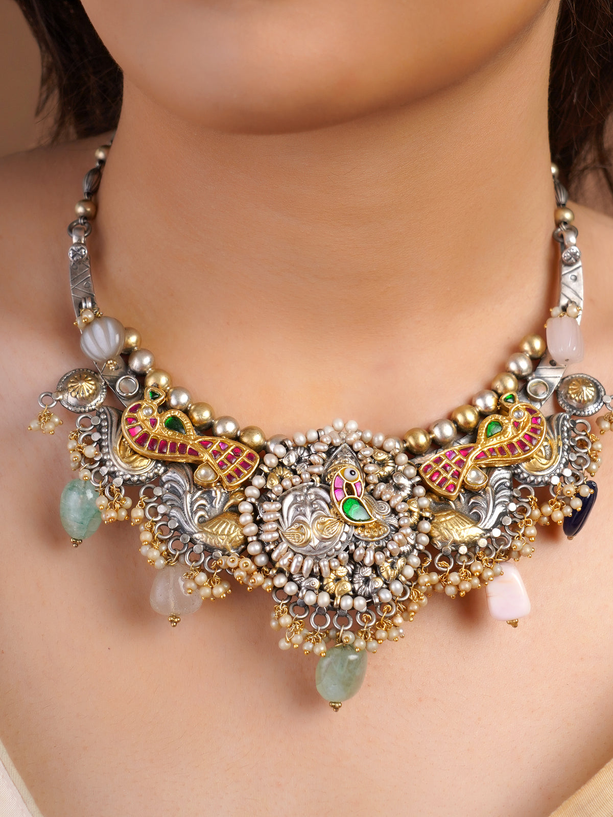 Sitamohur peacock pearl mixed metal fusion necklace styled with ivory saree and multicolour stone drops