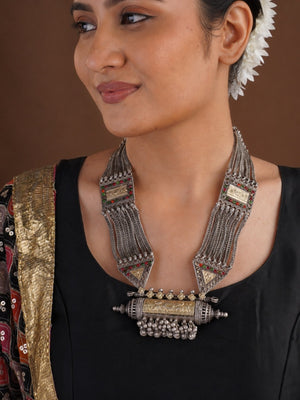 Close view of Sitavan oxidized tribal necklace with braided chains geometric panels red green accents and ghungroo centre pendant