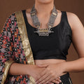 Sitavan chain panel ghungroo oxidized tribal necklace styled with black blouse and geometric silver-tone panels