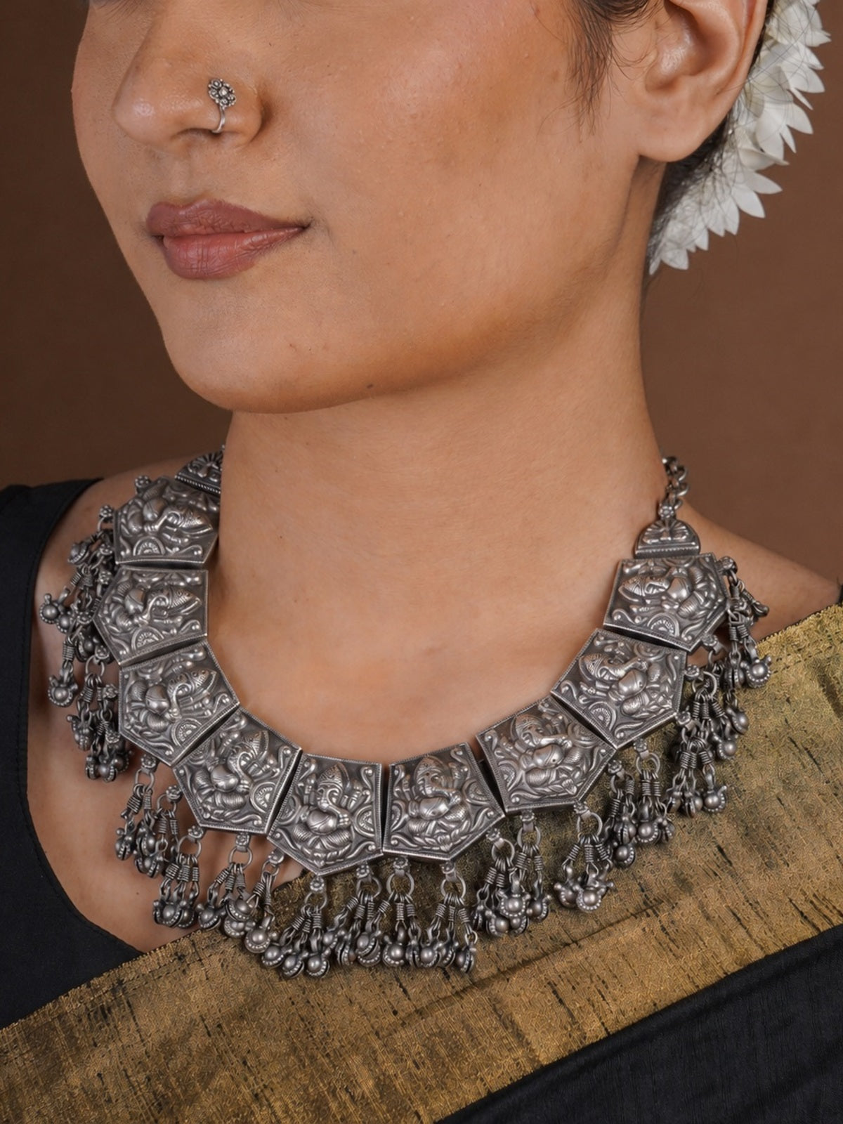 Sitavan Ganesha panel oxidized statement collar necklace styled with black saree and matching round oxidized stud earrings
