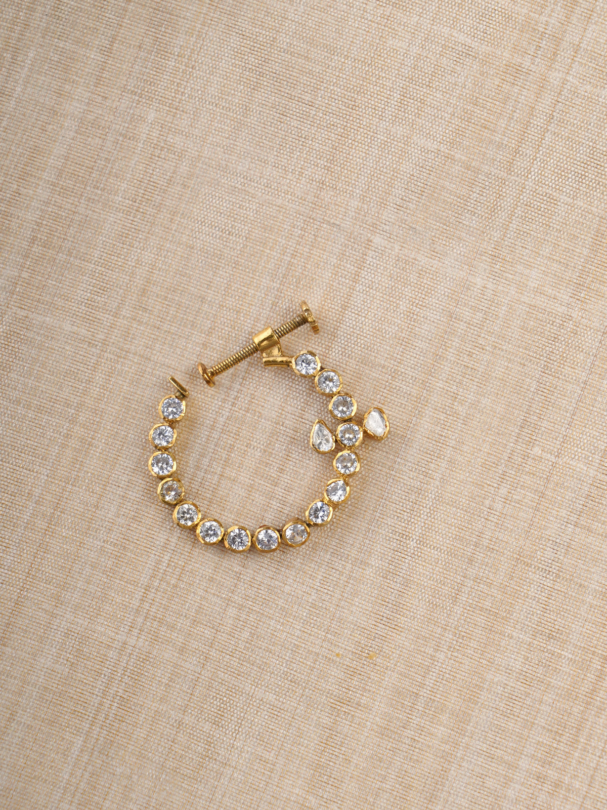 Sitaratna gold-plated round moissanite nath worn on model