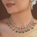 Sitamani emerald green floral AD CZ necklace set with sparkling white stone vines and matching drop earrings
