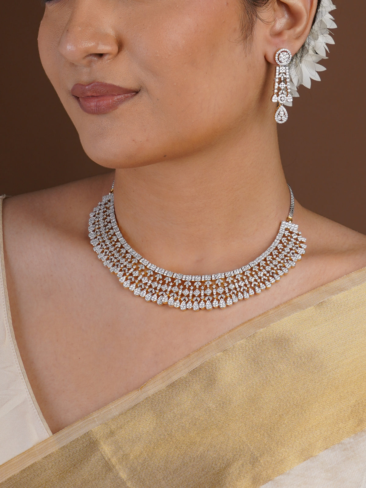 Sitamani diamond look chandelier earring close-up with circular stud, geometric links and teardrop dangle