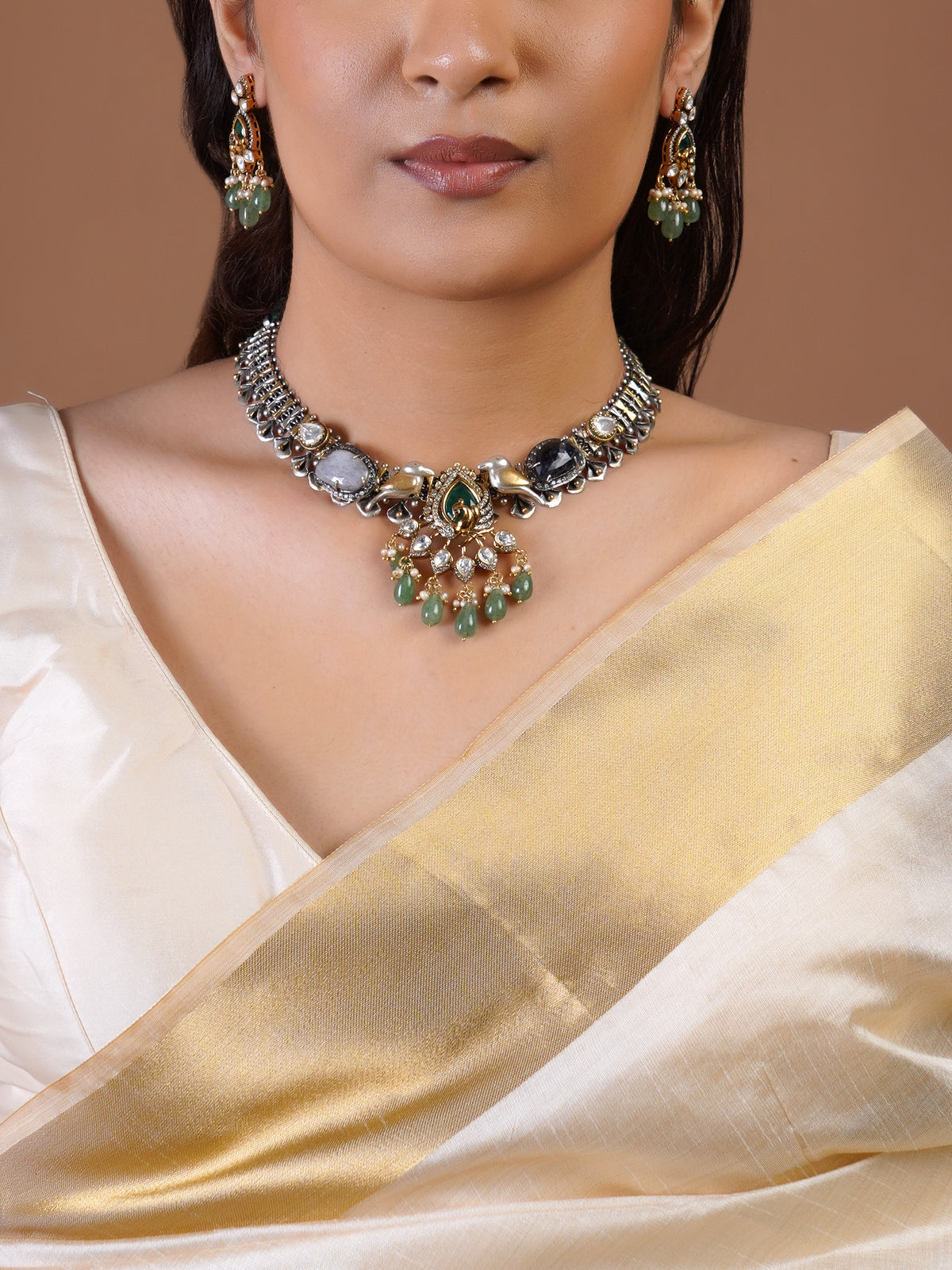 Sitamahor fusion matching earring close-up with green teardrop stones, pearl clusters and gold silver mixed metal setting