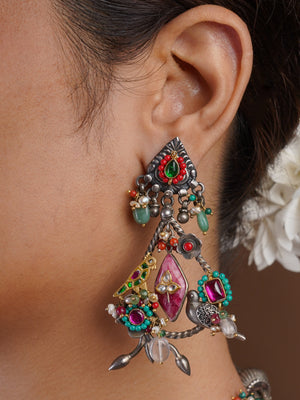 Sitamahor Navrangi artisan fusion chandelier earring with oxidised silver-tone frame, ruby pink, green and turquoise accents by SITA JEWELRY