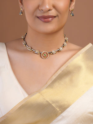Sitamohur matching two-tone fusion earring close-up with gold floral stud and textured silver barrel drop