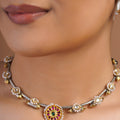 Sitamohur pearl floral two-tone fusion choker with silver-gold mixed metal details, ruby green centre medallion and matching earrings