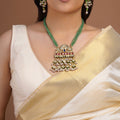 Samragni green bead peacock kundan pendant necklace set with ruby blue stones, pearl clusters and matching statement earrings