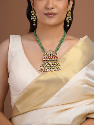 Samragni green bead peacock kundan pendant necklace set with ruby blue stones, pearl clusters and matching statement earrings
